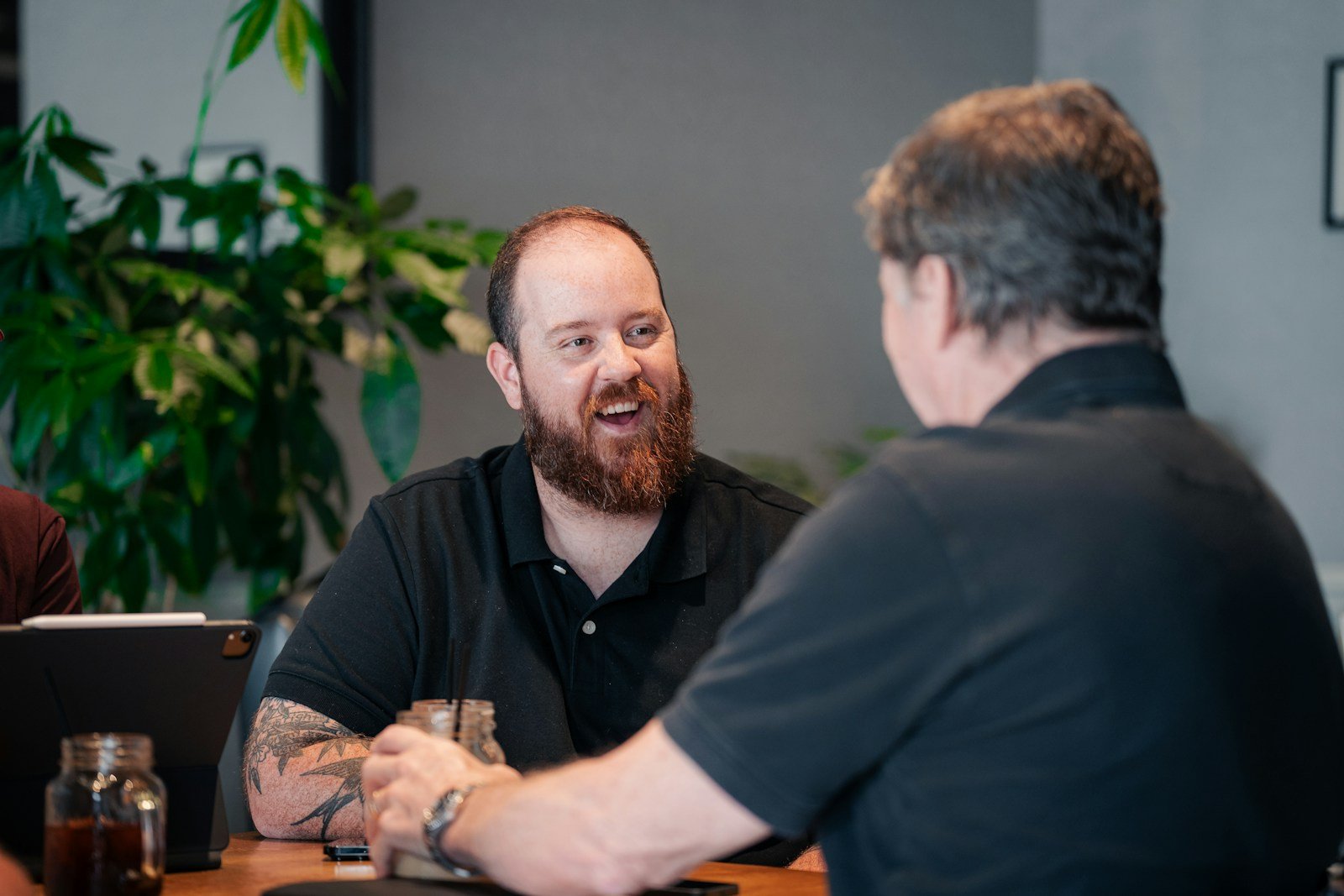 Crack Your Next Tech Role with These Top Selenium Interview Questions 16 two men sitting at a table talking to each other