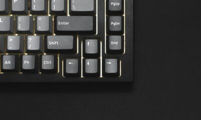 a close up of a keyboard on a black surface