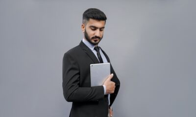 a man holding a tablet