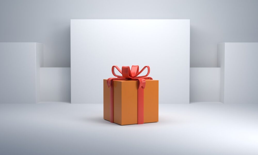 an orange gift box with a red bow