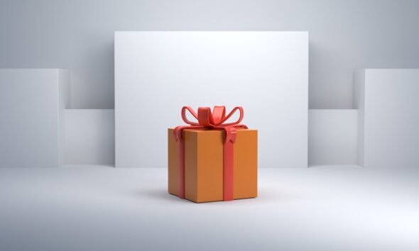 an orange gift box with a red bow