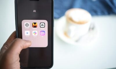 a person holding a cell phone in their hand