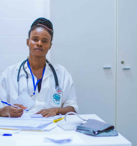 doctor sitting at the table in front of girl