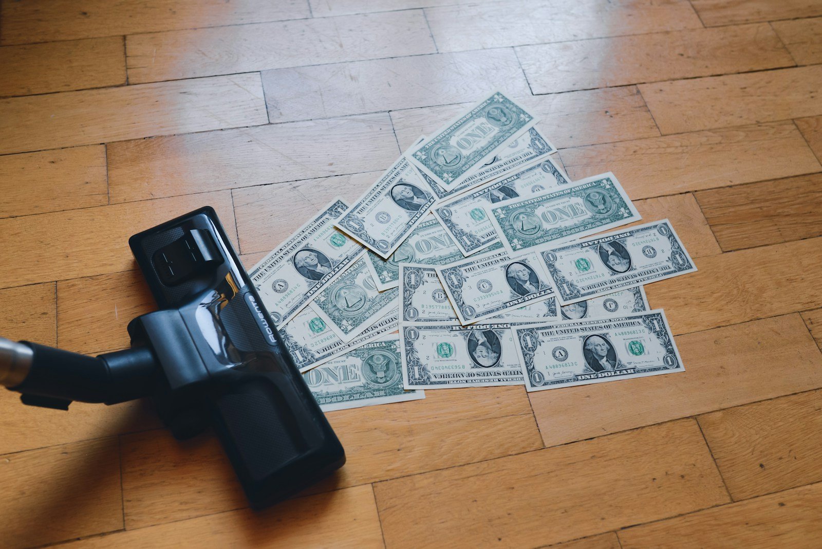 Crypto or cash? Choosing the best payout method as a YouTuber 16 a pile of money sitting on top of a wooden floor
