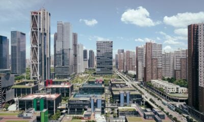 Modern city skyline with tall buildings and blue sky.