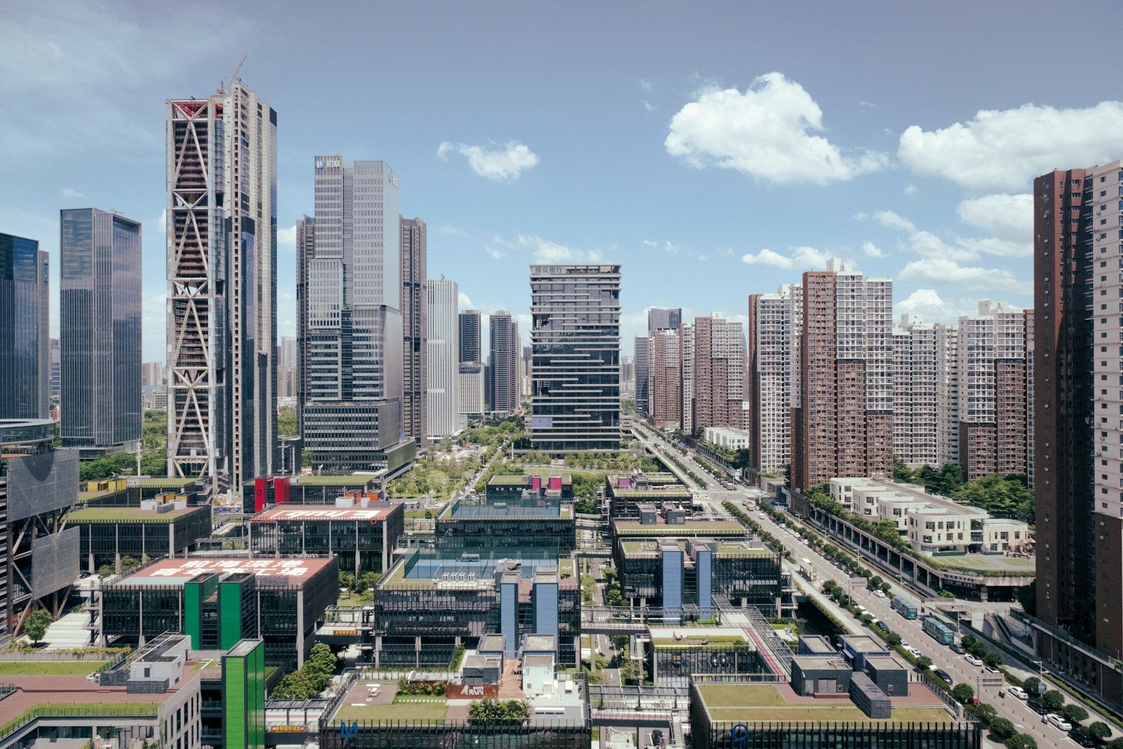 Modern city skyline with tall buildings and blue sky.