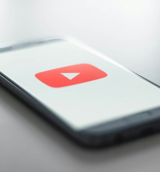 a close up of a cell phone with a youtube logo on it
