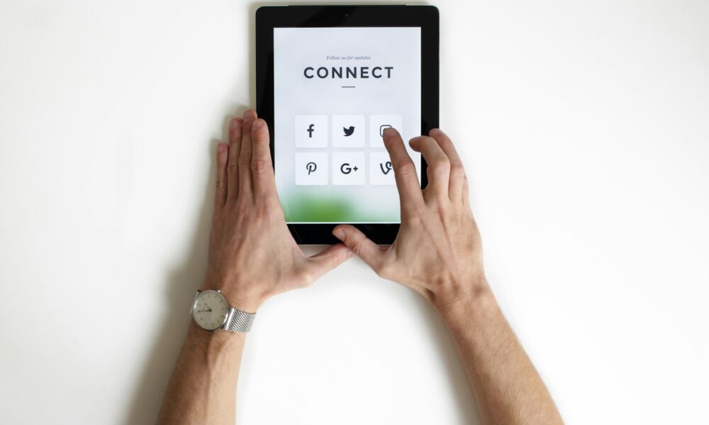 person using black iPad