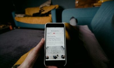 person holding white iphone 5 c