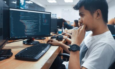 person holding a computer mouse in a room