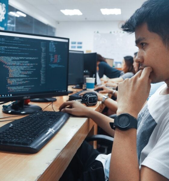 person holding a computer mouse in a room