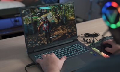 a person playing a video game on a laptop