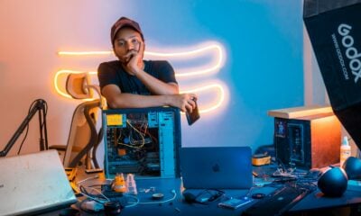 A man sitting in front of a laptop computer