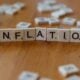Inflation is spelled out using scrabble tiles.