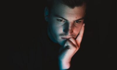 man in black shirt with blue eyes