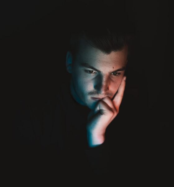 man in black shirt with blue eyes