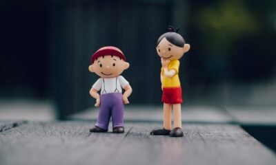 two boy and girl plastic toys