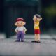 two boy and girl plastic toys