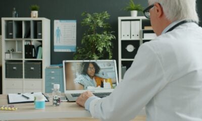 Doctor consults with patient via video call.