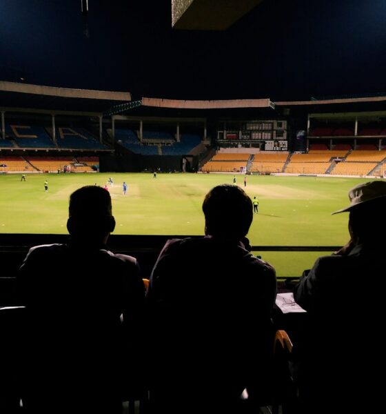 people watching soccer game during nighttime