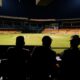 people watching soccer game during nighttime
