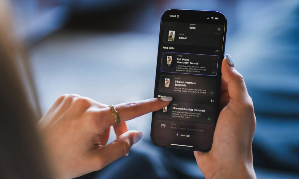 Person using a smartphone with a list on the screen