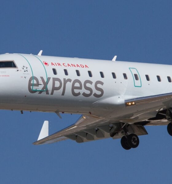 white airplane flying