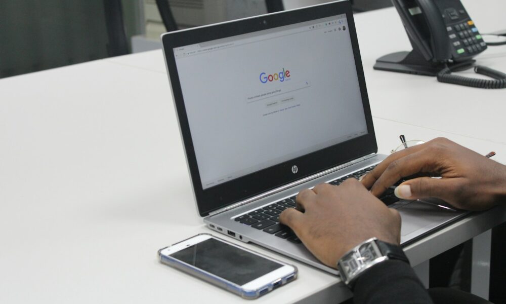 person typing on gray and black HP laptop | how to use google authenticator transfer