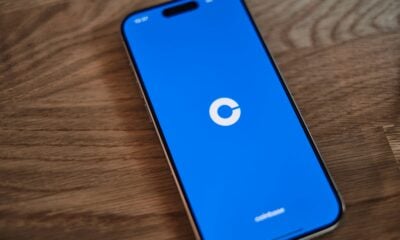 A cell phone sitting on top of a wooden table