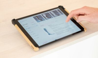 a person using a tablet on a table