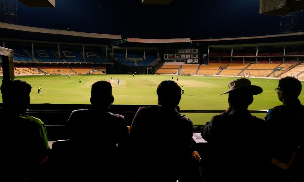 people watching soccer game during nighttime