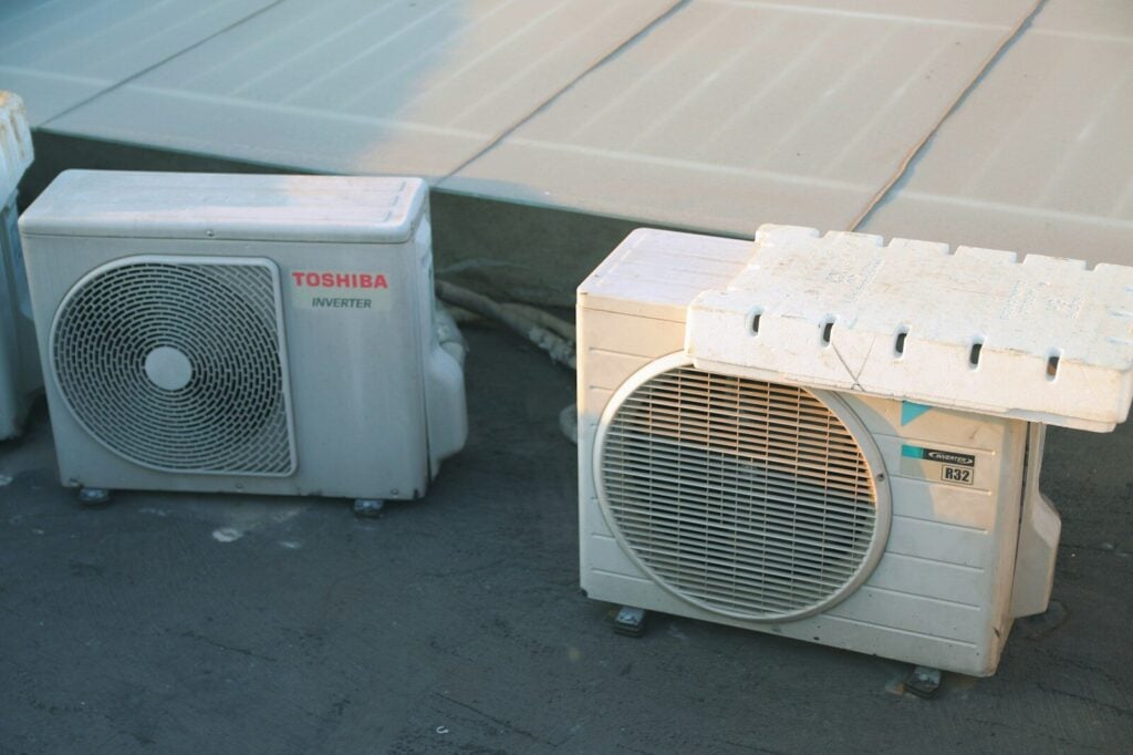 How to make money in heating and air conditioning business? 18 a couple of air conditioners sitting next to each other. how to make money in heating and air conditioning business