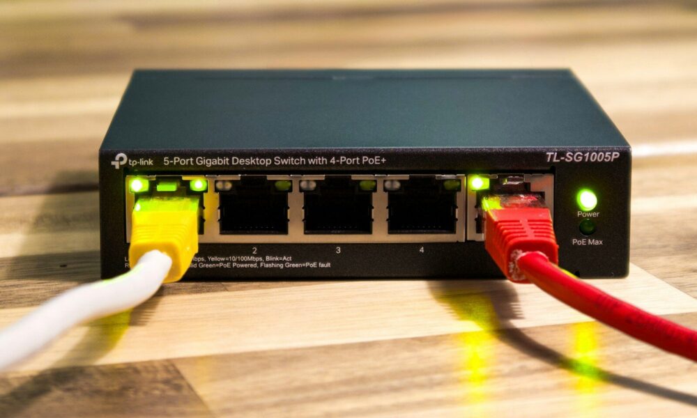 A network switch with ethernet cables connected. cnc router significance