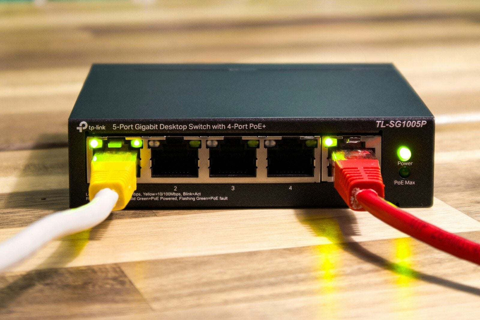 A network switch with ethernet cables connected. cnc router significance