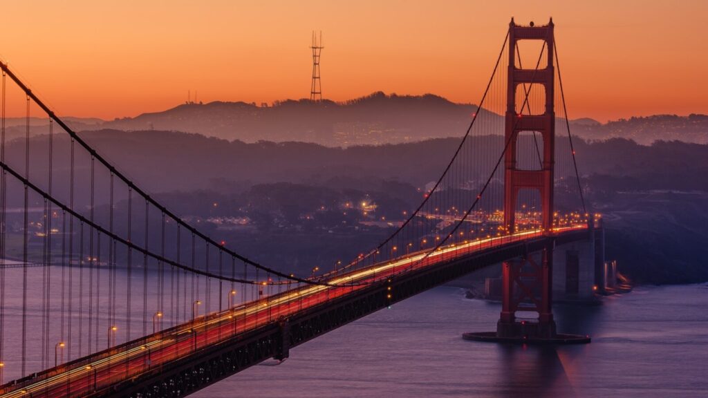 Golden Gate Bridge during sunset. Budget Travel Tips for Expensive Cities in the USA