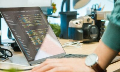 gray laptop computer on brown wooden desk