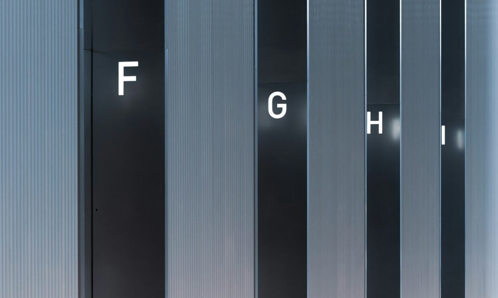 Abstract pattern of vertical lines and letters