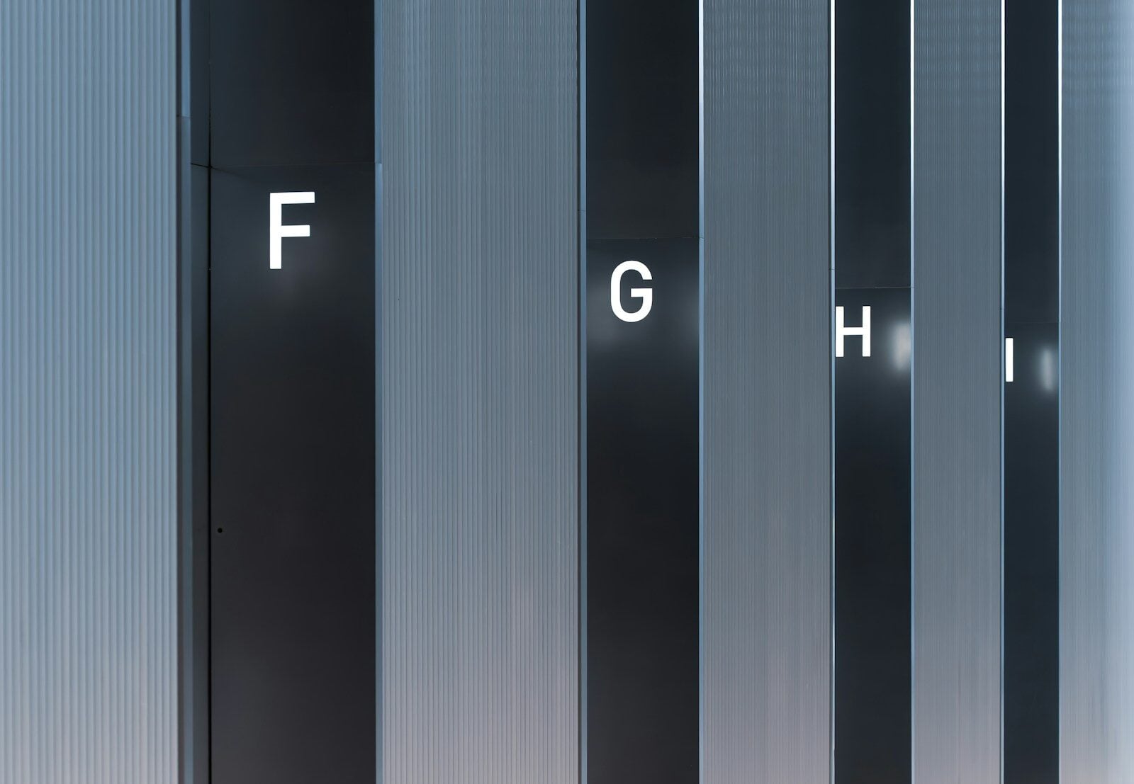 Abstract pattern of vertical lines and letters