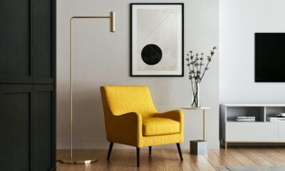 brown wooden framed yellow padded chair