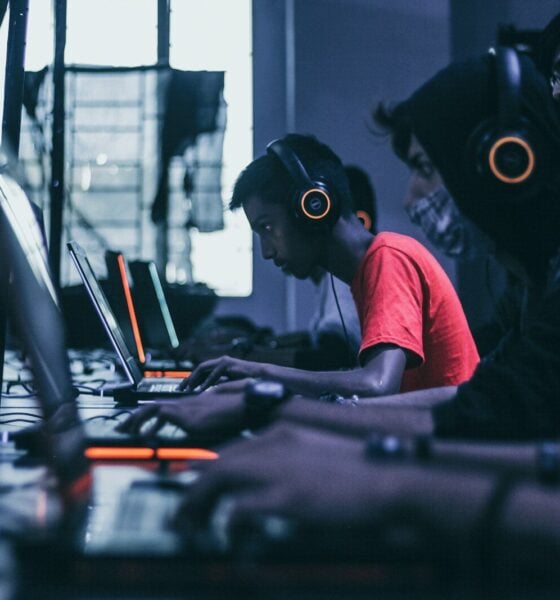 man playing on laptop