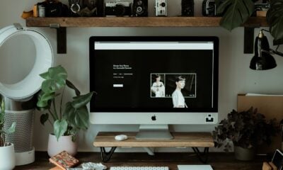 silver imac on brown wooden table