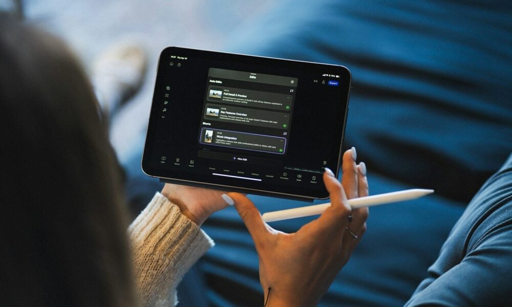 Person holding a tablet and stylus device.