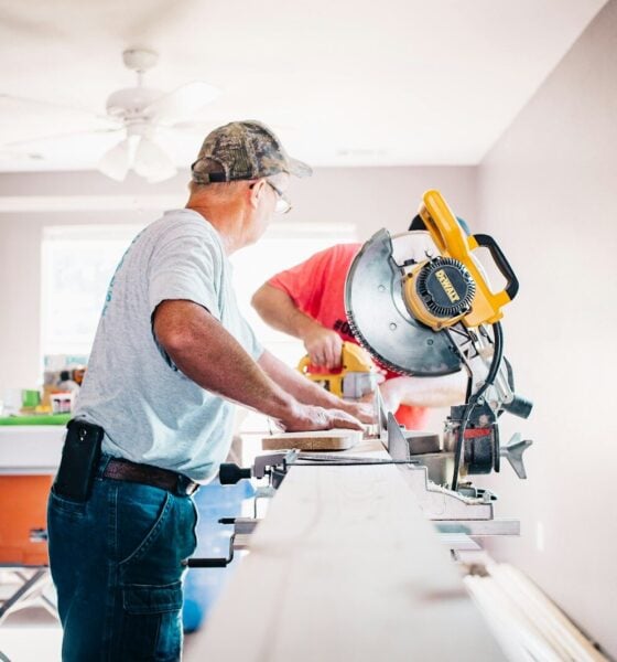 man standing infront of miter saw