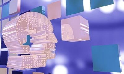 a person's head with a circuit board in the background