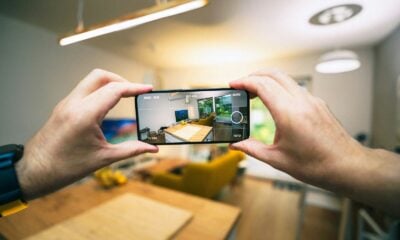 A person taking a picture with a cell phone