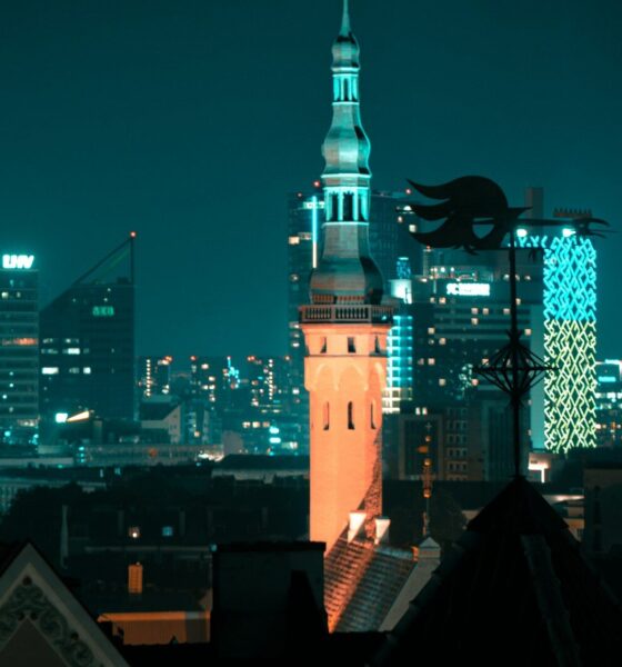 a view of a city at night from a rooftop