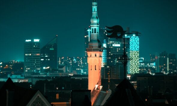 a view of a city at night from a rooftop