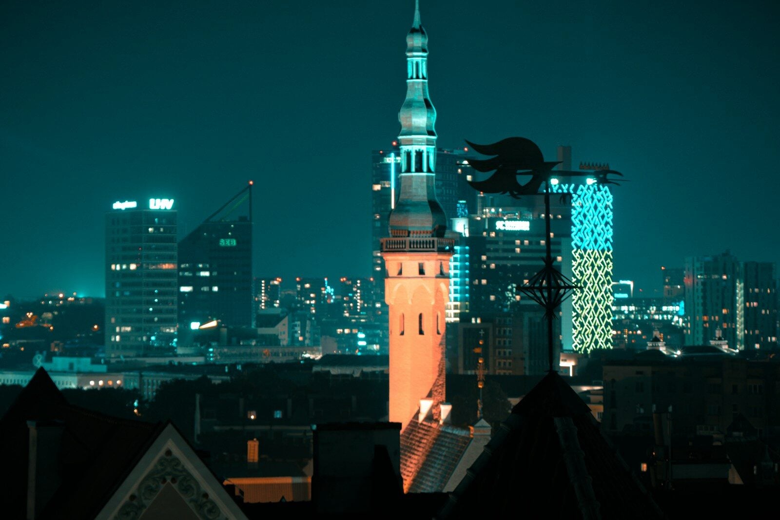 a view of a city at night from a rooftop