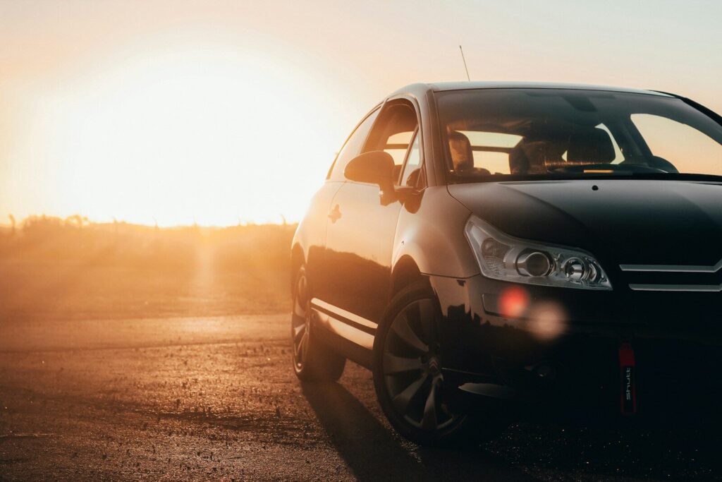 black volkswagen golf on road during sunset