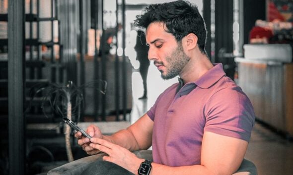 A man is looking at his phone.